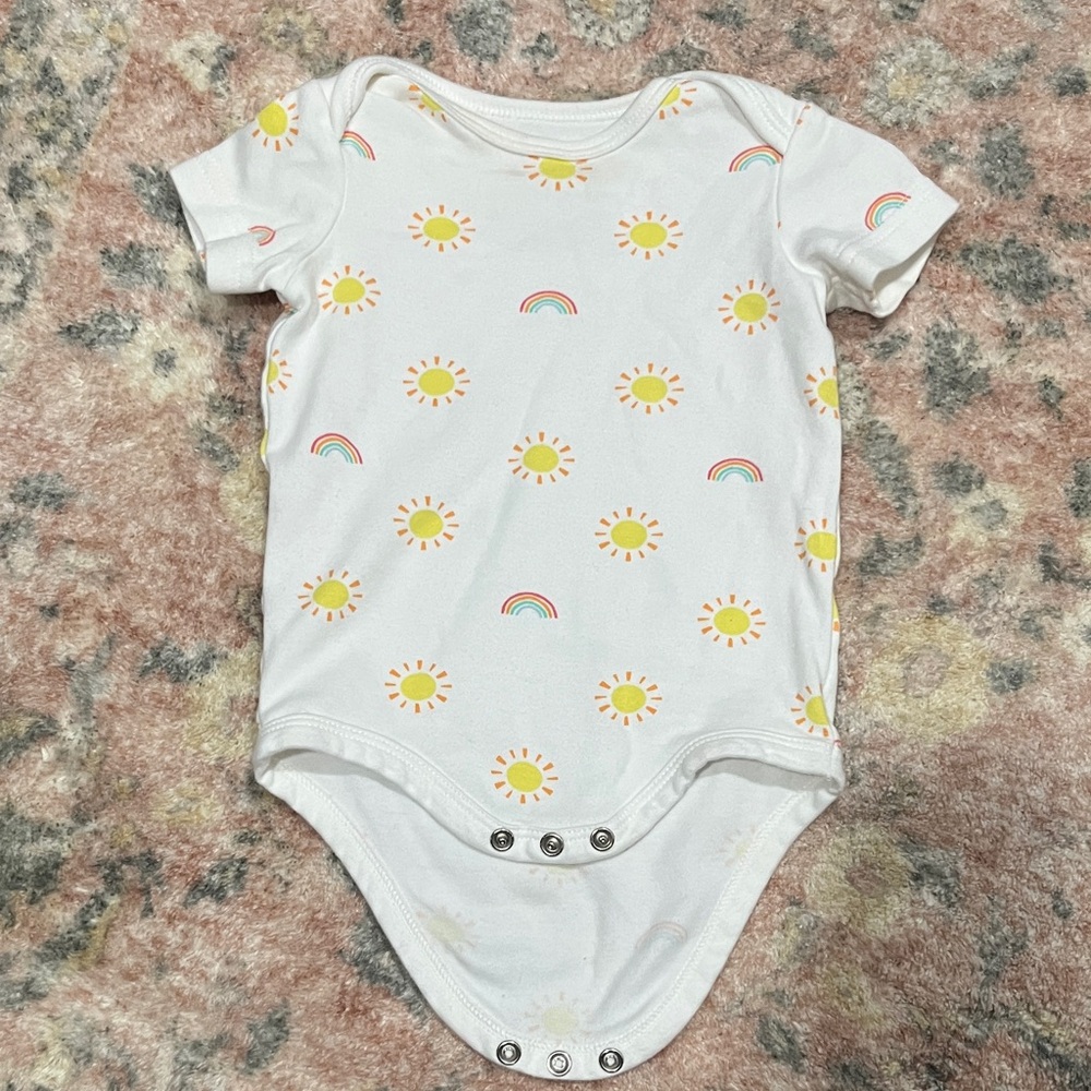 Primary White Bodysuit with Yellow Suns and Rainbow Print